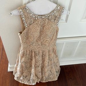 Beautiful dress my daughter wore twice for photos.   Neutral color